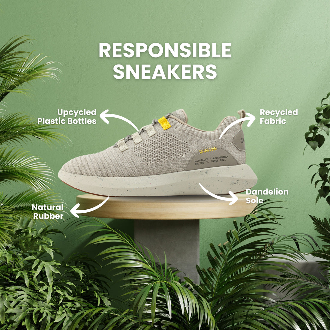 SNNCE Sneakers on pedestal among green plant foliage with arrows pointing out materials: upcycled plastic bottles, recycled fabric, Dandelion Sole, Natural Rubber